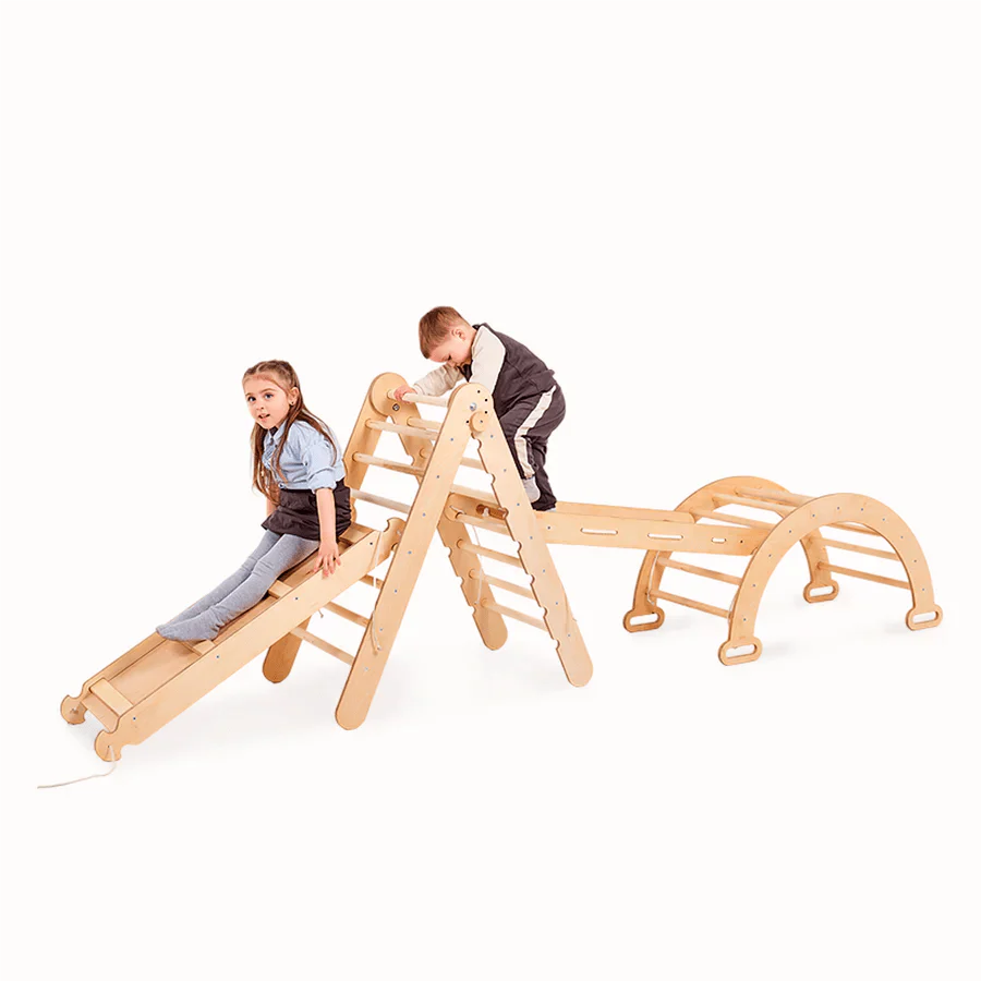 Children playing on a wooden climbing toy with a white background