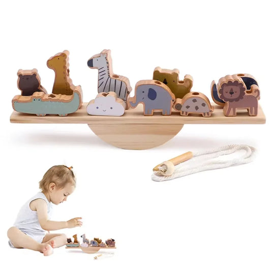 Wooden balance toy with animal figures and a child playing with it on a white background