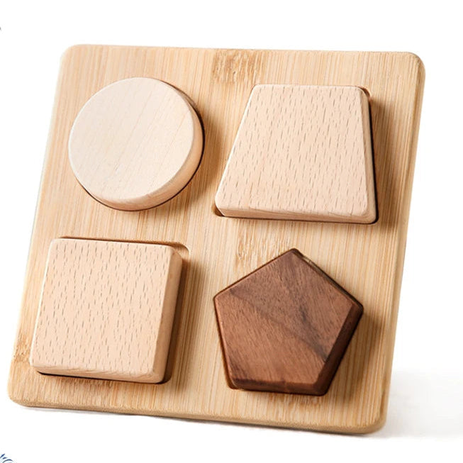 Wooden shape sorting toy with a child playing with it on a white background