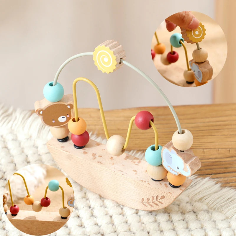 Wooden baby toy with colorful beads on a soft surface