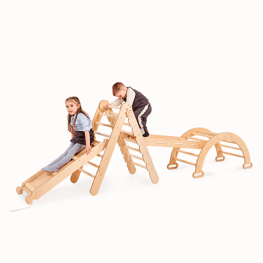 Children playing on a wooden climbing toy with a white background