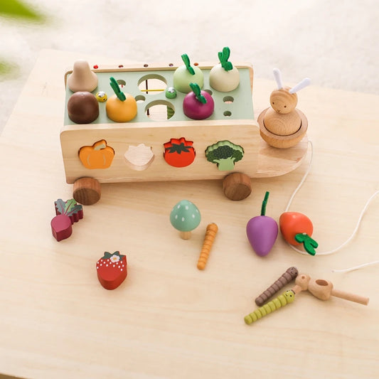 Wooden toy set with various colorful vegetables on a light wooden surface